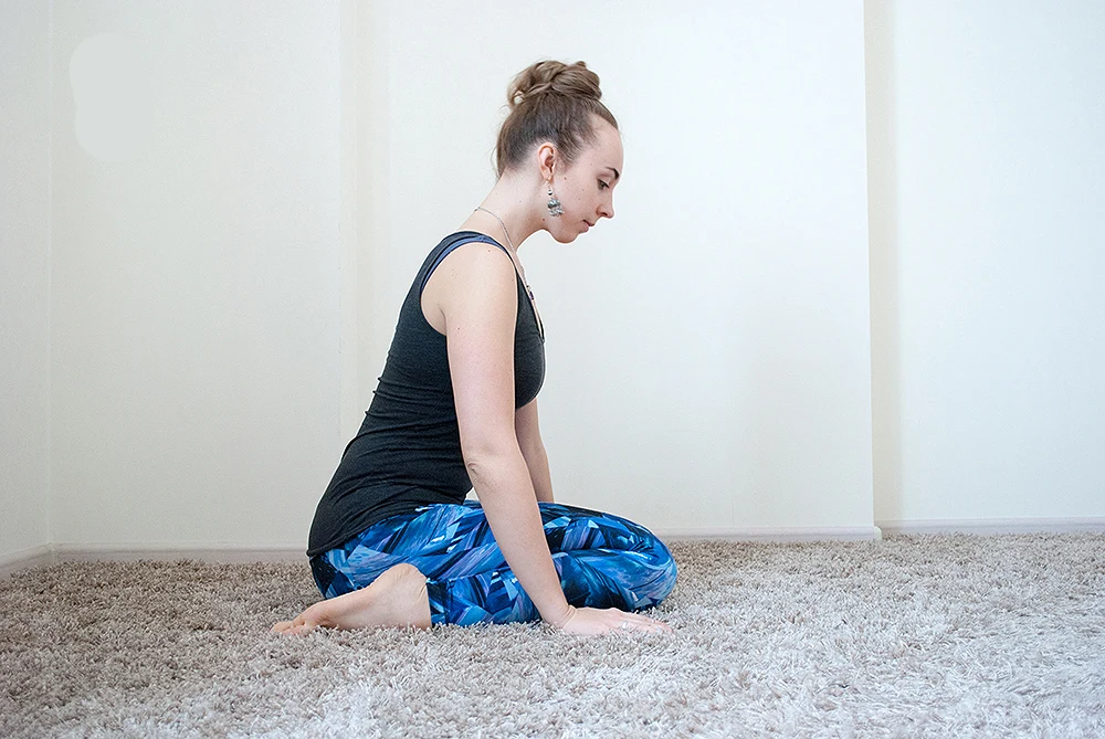 Step 2: Roll forward over crossed ankles