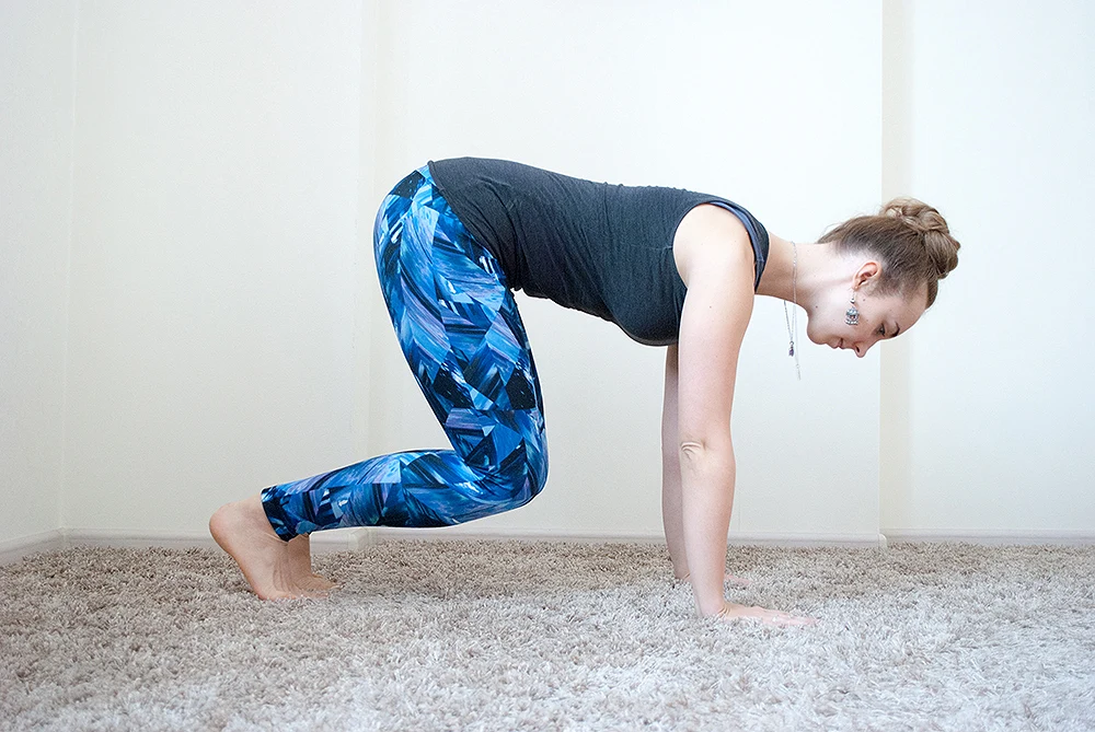 Step 1: Cross ankles with knees wide