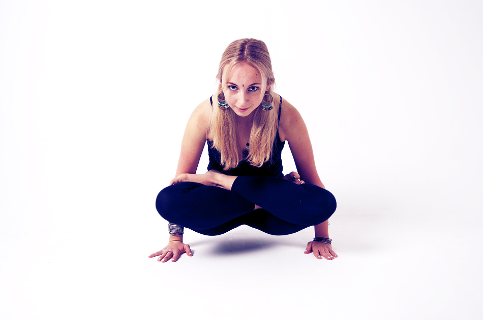 Anandi seated in a yoga meditation posture